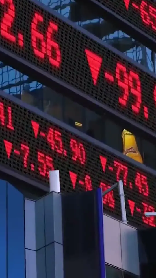 Trading ad: a market board filling with red as prices fall
